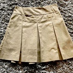 School Uniform Tan Pleated Skirt, Shorts, Side Zipper With A Pocket. Juniors Size 5, Measures 19 “ From The Waistband To The Hem, 15” At The Waistband As Pictured. New Without Tags, Never Worn. Cute Khaki Shorts, Tan Pleated Skirt, School Uniform Skirts, Uniform Skirt, Tan Skirt, Khaki Skirt, Jersey Outfit, Skirt Shorts, School Uniforms