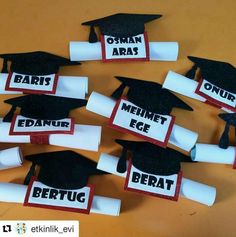 graduation caps and diplomas are arranged in the shape of letters on top of each other