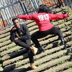 two people are doing tricks on some stairs