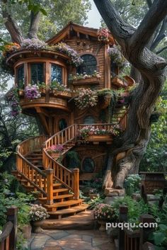 a tree house with stairs and flowers on it