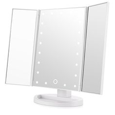 a white table top mirror sitting on top of a stand