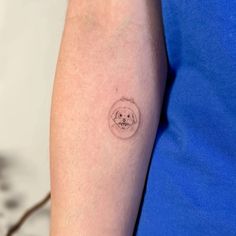 a person with a small tattoo on their arm