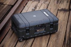 a black case sitting on top of a wooden floor