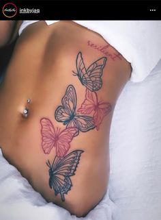 a woman's stomach with butterflies on it