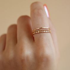 Discover modern elegance with the SoHo Ring Set. This triple ring stacking set crafted from our most popular rings- the sequin, hammered, and spiral stacking bands, is an easy way to add luxe to your everyday look DETAILS Sizes 4-12 including half sizes Available in 14k gold fill or sterling silverSet includes 3 rings of all the same size- one Sequin, one Hammered, and one Spiral Mixed Metal Ring Stack, Minimalist Rings Stacking, Stacked Gold Rings, Ring Stack Gold, Stacking Rings Silver, Modern Gold Ring, Minimalistic Ring, Stacked Rings, Triple Ring