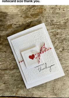 a white card with red hearts on it and the words, notecard size thank you