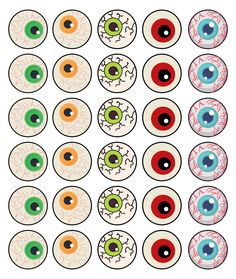 an assortment of different colored eyeballs on a white background