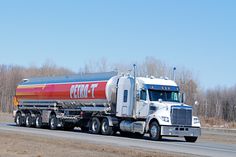 a large tanker truck driving down the road