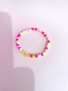 This is a pink lemonade theme bracelet. I made this by myself. Handmade Trendy Yellow Bracelets, Trendy Handmade Yellow Bracelets, Casual Pink Stretch Bracelet With Round Beads, Pink Fun Bracelets With Round Beads, Fun Pink Beaded Bracelets, Fun Pink Bracelets With Round Beads, Playful Pink Beaded Bangle Bracelet, Fun Pink Beaded Bracelets With Round Beads, Playful Pink Beaded Bangle Bracelets