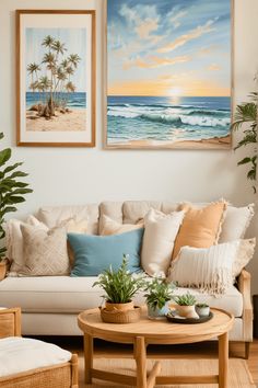 a living room with two paintings on the wall and a coffee table in front of it