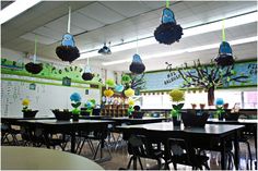 an empty classroom with tables and chairs decorated for the school's spring break,