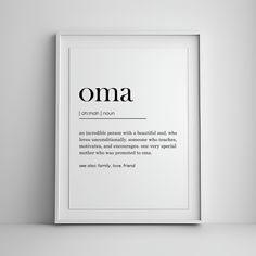 a white framed poster with the words oma in black and white font on it