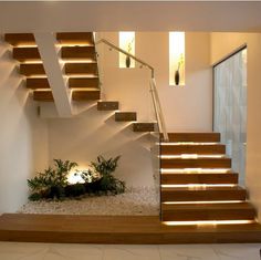 the stairs are made of wood and have lights on them