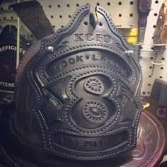 a fireman's helmet sitting on top of a table