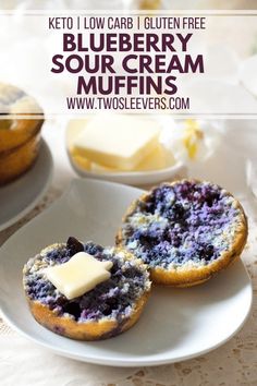 blueberry sour cream muffins on a white plate with butter in the middle