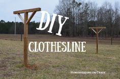 a sign that says diy clothesline in front of an empty field with trees