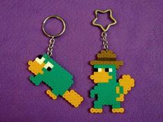 two keychains made to look like cartoon characters