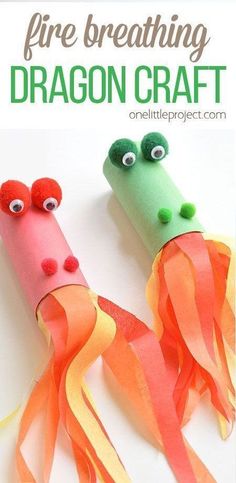 two fire breathing dragon craft sticks with googly eyes and orange streamers on them