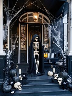 a skeleton statue in front of a house decorated for halloween