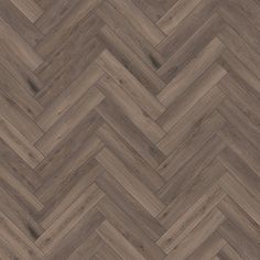 an image of wood flooring that looks like chevroned herringbones in grey