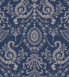 a blue and white wallpaper with an ornate design