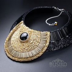 Black & gold set of jewerly for lovers of stunning exclusive. This bib statement necklace is created for those who prefer chic in modern style. Necklace: Closure - lobster claw. There is a chain extension cable that will easily adjust the length of this necklace. The length of the necklace is 17 inch, the extension is 4 inch. Necklace width - 3.5 inch. Materials: Czech beads, Japan beads, Black agate cabochon, beads of different shapes, eco-suede, stainless steel clasp and fittings. Bracelet Elegant Beaded Chain Jewelry, Bohemian Gold Embellished Necklace, Handmade Choker Jewelry, Handmade Elegant Beaded Necklaces For Fashion, Gold Embellished Necklace For Gift, Gold Embellished Necklace Perfect For Gift, Handmade Gold Choker Bib Necklace, Handmade Gold Bib Necklace Choker, Handmade Gold Bib Necklace Shaped As A Choker