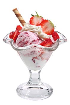 an ice cream sundae with strawberries in a glass dish on a black background