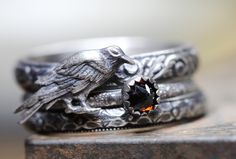 Three mysterious rings. The first is a darkened ring with a  raven.  It is perched on a "vines" patterned sterling ring.  The second is  dots patterned, with a gorgeous faceted  fire citrine, 4mm in size, set in a serrated 4mm silver bezel. The last is beautiful 3.5mm wide floral patterned ring. All rings are antiqued/darkened.  All solid sterling silver. Any size.  Please size up 1/2 size due to the width of this set for the most comfortable fit. Other variations/combinations and stones possibl Raven Ring, Sterling Silver Stacking Rings, Stacking Ring Set, Witchy Jewelry, Pattern Ring, Silver Stacking Rings, Citrine Ring, Samhain, Crows