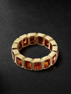 42 SUNS' dedicated team of master goldsmiths work to showcase the beauty of precious stones. This eternity ring is cast from 14-karat gold and set with emerald-cut, laboratory-grown orange sapphires. Wear it solo or alongside a thin band. Emerald Watch, Emerald Eternity Ring, White Gold Sapphire Ring, Sapphire Eternity Ring, Gold Sapphire Ring, Gold Topaz, White Gold Sapphire, Orange Sapphire, Cubic Zirconia Rings