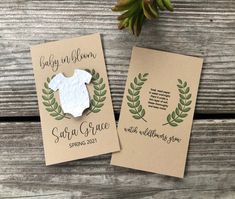 two wedding brochures on top of a wooden table