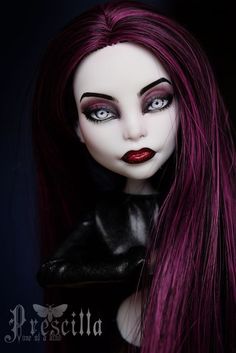 a doll with long purple hair and black makeup is posed for a photo in the dark