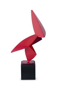 a red sculpture sitting on top of a black base