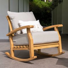 Enjoy peaceful afternoon in this Auburn Teak Patio Rocking Chair from Cambridge Casual. Its smooth rocking motions takes you to havana in an instance. Beautifully constructed of fine quality solid teak wood and combined with thick spun-polyester cushions with beautiful design in blue spruce, beige and navy color. This patio rocking chair would be your favorite spot at home. Pair this beautiful rocking chair with other matching pieces from Auburn collection to create the best patio conversation s Poolside Pergola, Lake Home Interior, Teak Rocking Chair, Outdoor Rocking Chair, Weathered Teak, Wood Rocking Chair, Plush Cushion, Patio Rocking Chairs, Blue Spruce