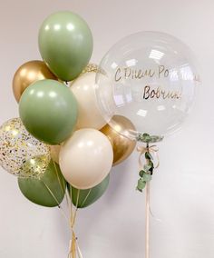 a bunch of balloons that are sitting on a table