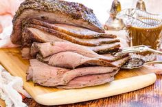 sliced roast beef sitting on a cutting board