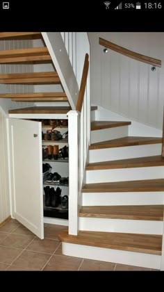 there is no image here to provide a caption for in this case, you can see the shoe storage area under the stairs