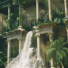 an artistic painting of a waterfall in front of a building with columns and palm trees