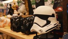 a star wars helmet is sitting on a shelf