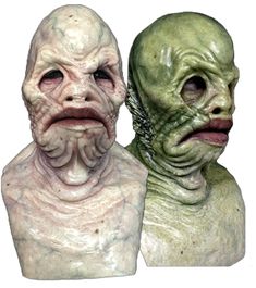 two alien heads are shown next to each other