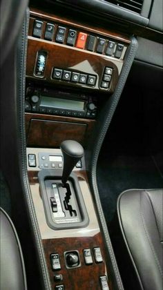 the interior of a car with buttons and controls