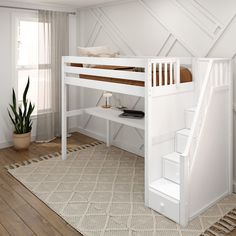 a white loft bed sitting next to a wooden stair case in a room with wood flooring