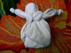 a small white bag sitting on top of a colorful rug