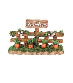 a wooden sign that says my garden with potted plants