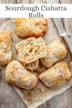 some type of bread that is on top of a piece of paper with the words sourdough ciabatta rolls