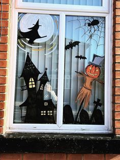 there is a window decorated with halloween decorations