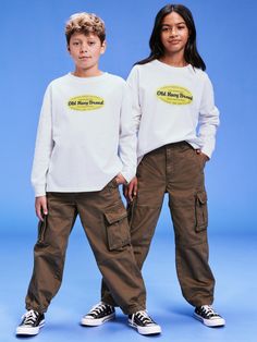 crew neck long sleeves logo graphic at front it's a big deal relaxed fit hits below waist both models wear size mmachine wash according to the care instruction label  . Best Holiday gift for , perfect T Shirts for Christmas! Kids Part, Family Maternity, Family Pajamas, Big Deal, 30th Birthday, Logo Graphic, Toddler Boys, Old Navy, Gender Neutral