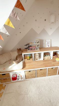 a child's playroom with toys and bookshelves in the corner,