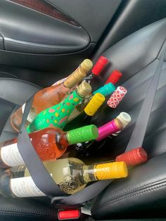 several bottles of alcohol in the back seat of a car