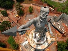 an aerial view of a statue in the middle of a construction area with text that reads, view the landscape from the observation deck at vulcann