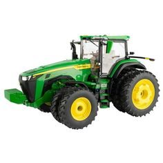 a green tractor with yellow wheels on a white background